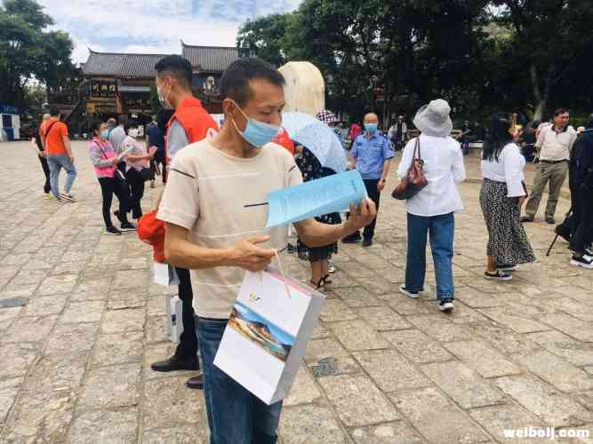 重走石鼓 发放惠民券 丽江举行中国旅游日系列活动 (1).jpg