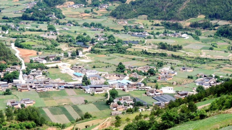 玉龙县首部村志《新主村志》正式出版