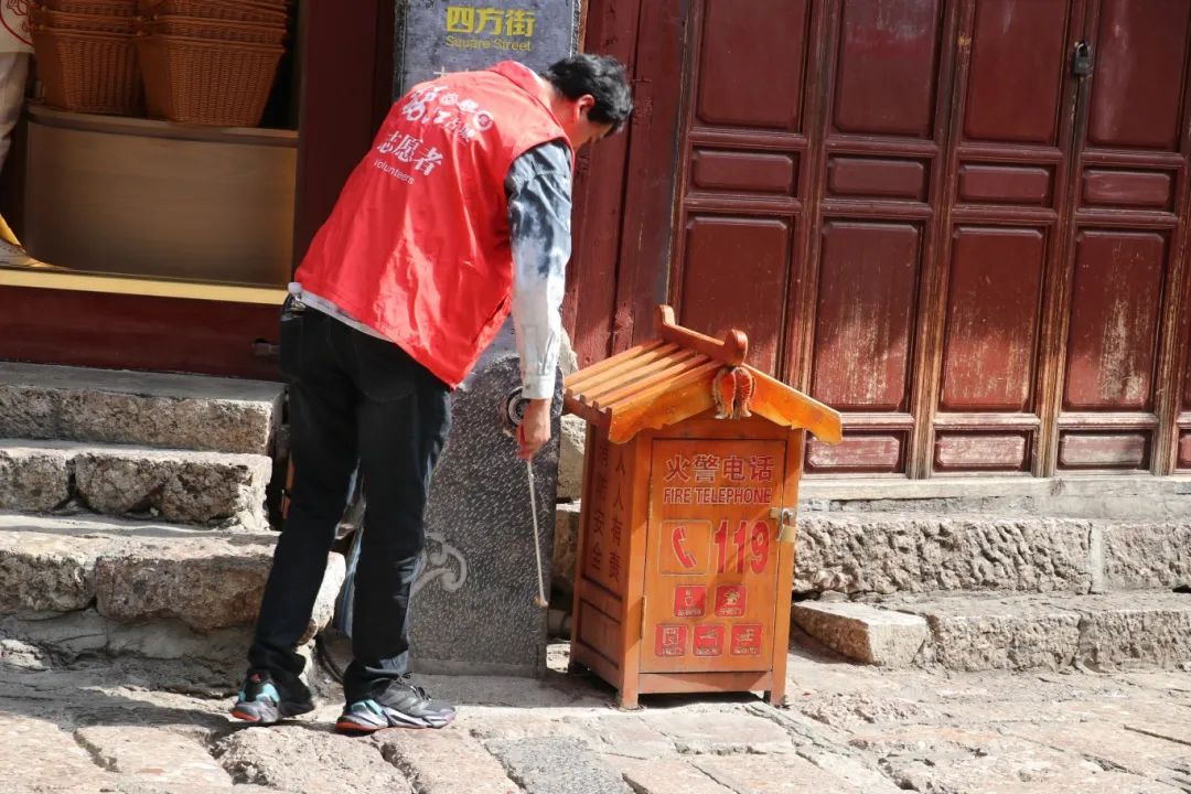 “5·19中国旅游日” 古城保护管理局（公司）开展志愿服务活动3.jpg